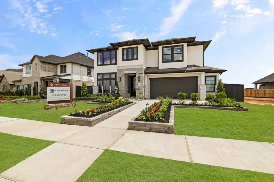 Front exterior of a new home in Harvest Green 50', Richmond, TX, highlighting curb appeal (Image 23).