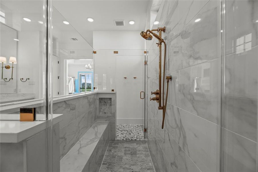 This is an amazing walk-in shower! Perfect place to start your day. The natural light from the window gives sparkle to the space.