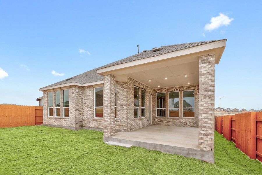 Exterior details and patio area of a home in Lariat, Liberty Hill (Image 21).