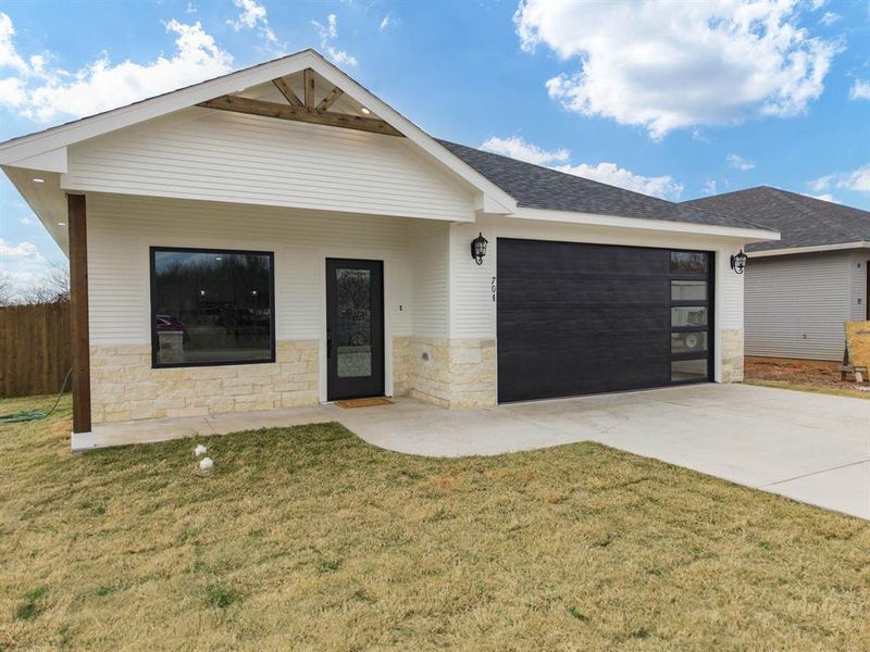 Front exterior of a new home in , Hillsboro, TX, highlighting curb appeal (Image 14). Front exterior of a new home in , Hillsboro, TX, highlighting curb appeal (Image 14).
