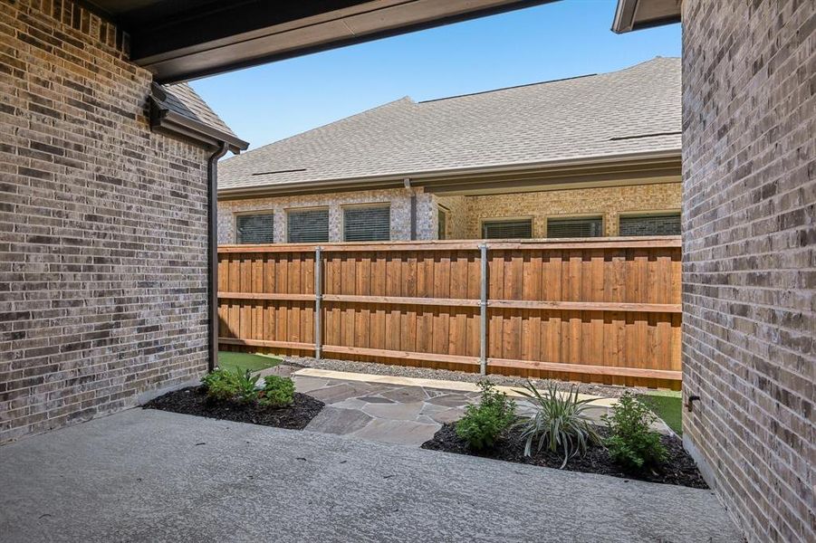 Exterior details and patio area of a home in Elements at Viridian - Garden Series, Arlington (Image 20). Exterior details and patio area of a home in Elements at Viridian - Garden Series, Arlington (Image 20).