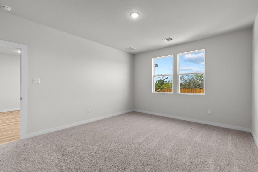 A room with a window and a carpet. A room with a window and a carpet.