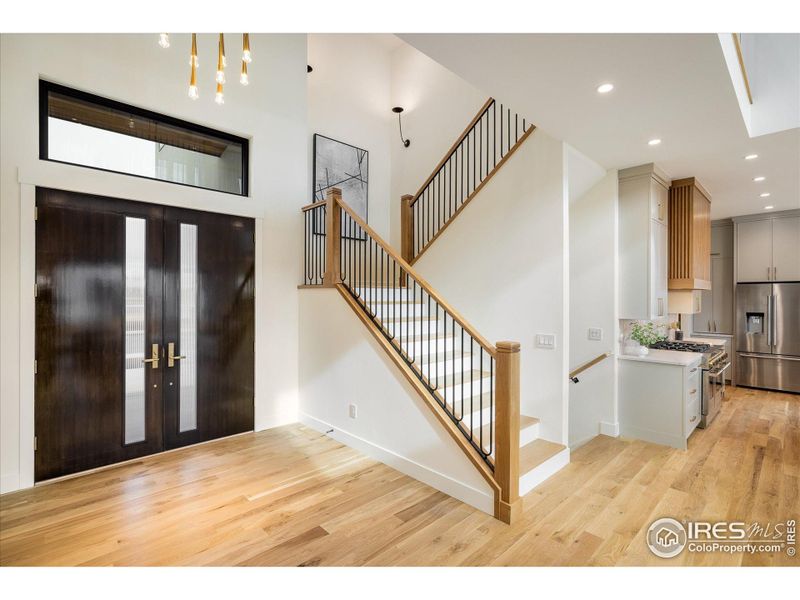 A stunning custom front door and generous entry welcomes you into this exceptionally finished new home.