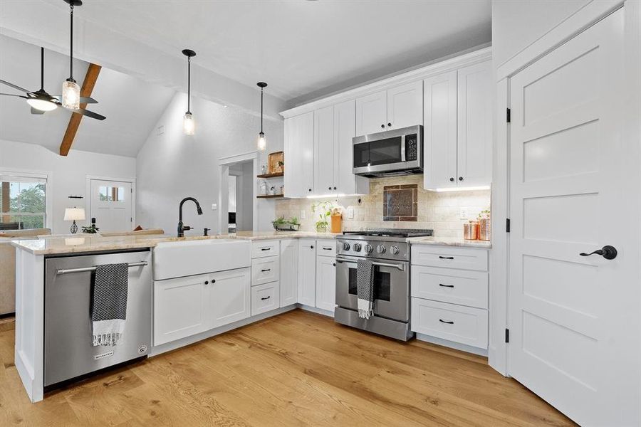 This gourmet kitchen in home number three opens up to the spacious living space