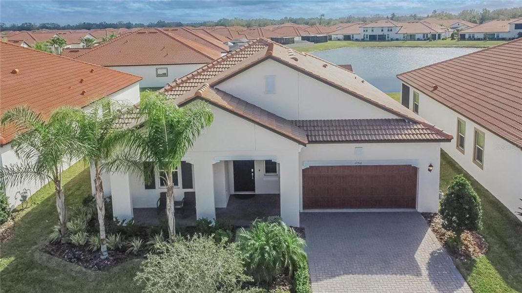Front exterior of a new home in Southshore Bay: The Estates, Wimauma, FL, highlighting curb appeal (Image 29).