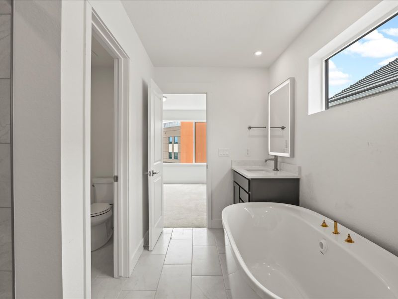 Furnished interior view inside a new home in Ascent at Inverness, Englewood (Image 12).