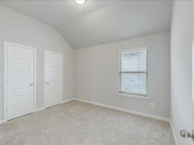 Bedroom in the Amber home plan by Trophy Signature Homes – REPRESENTATIVE PHOTO