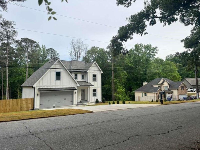 Front exterior of a new home in , Mableton, GA, highlighting curb appeal (Image 17).