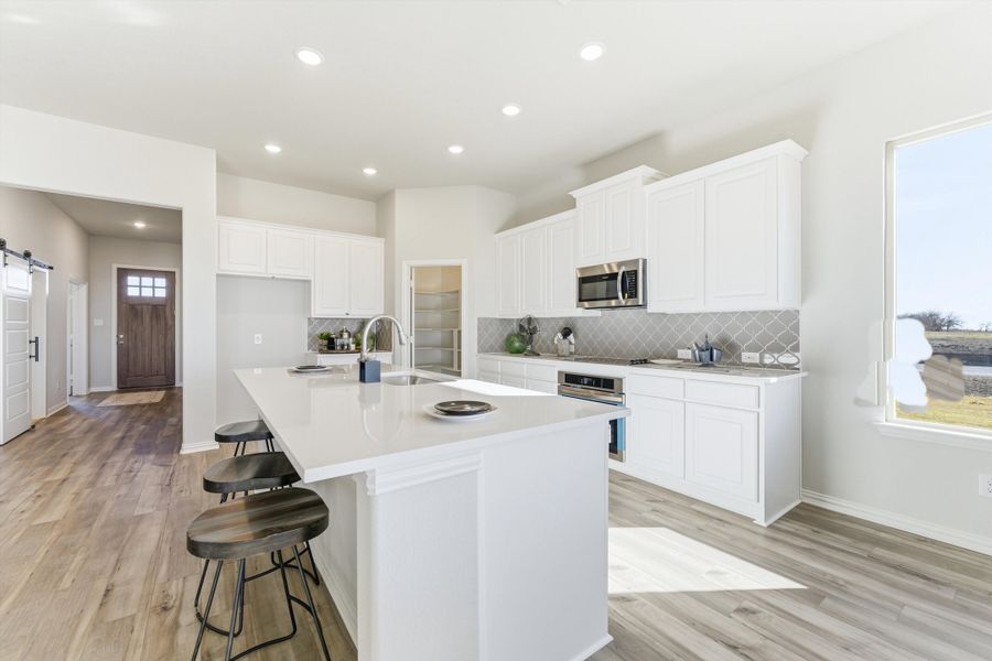 Furnished interior view inside a new home in Clear Sky Addition, Valley View (Image 14).