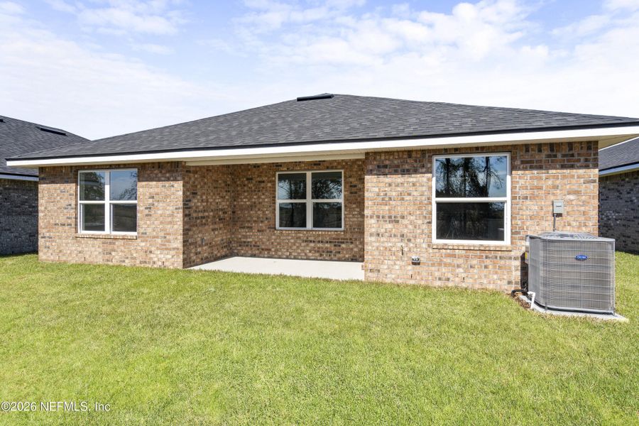 Exterior details and patio area of a home in Shadow Crest at Rolling Hills, Green Cove Springs (Image 4).