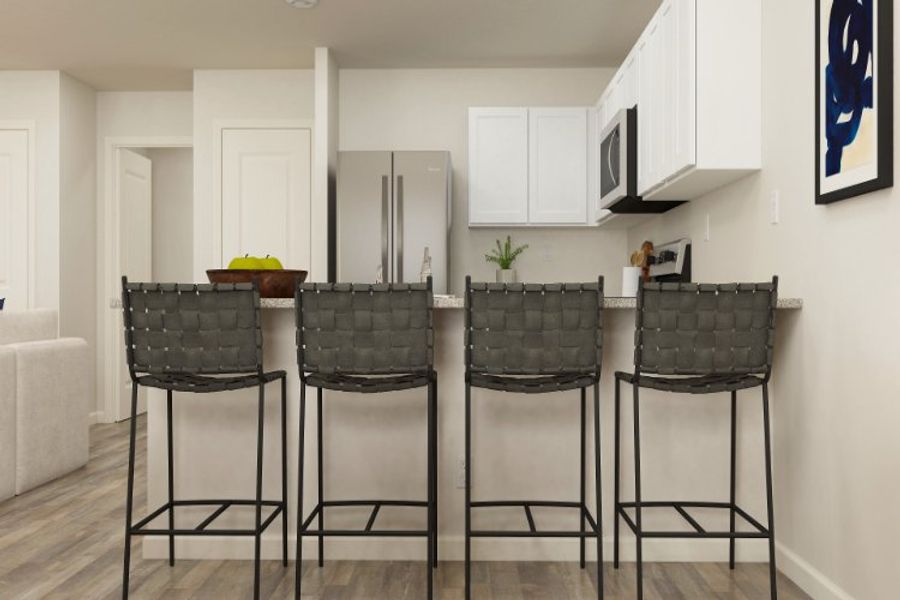 A kitchen with a table and chairs. A kitchen with a table and chairs.
