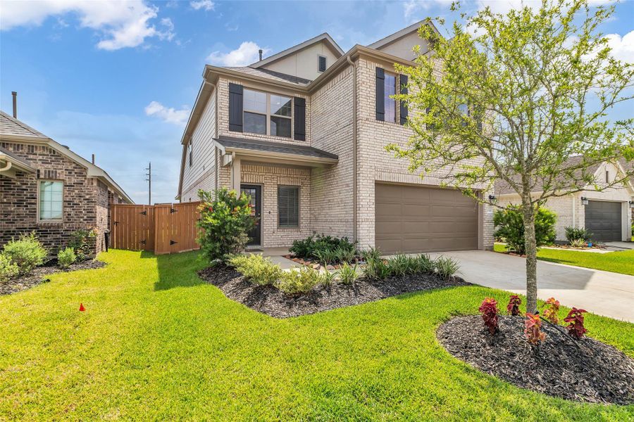 Front exterior of a new home in Marvida, Cypress, TX, highlighting curb appeal (Image 2). Front exterior of a new home in Marvida, Cypress, TX, highlighting curb appeal (Image 2).