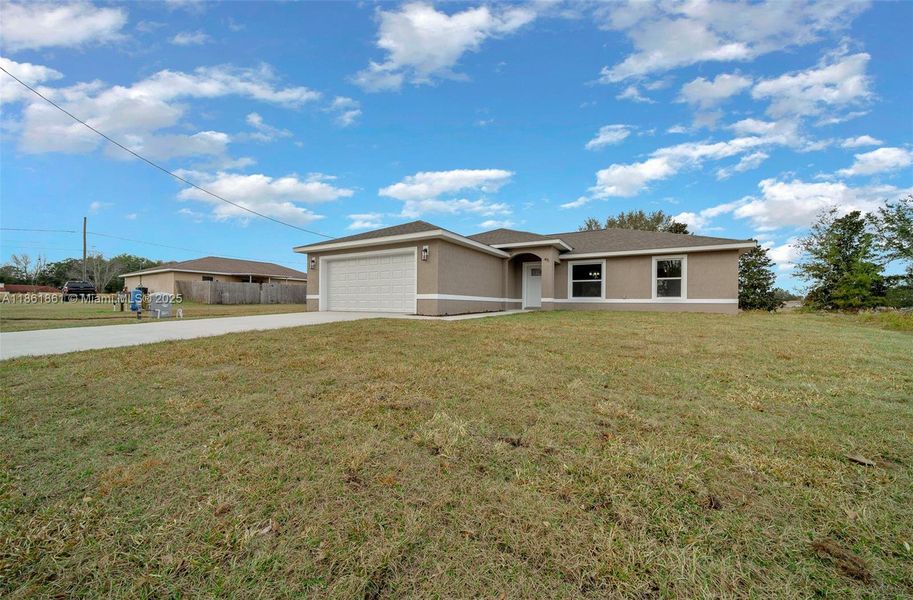 Front exterior of a new home in , Ocala, FL, highlighting curb appeal (Image 20).