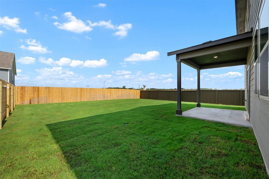 Exterior details and patio area of a home in Rolling Glen, Hutto (Image 24).