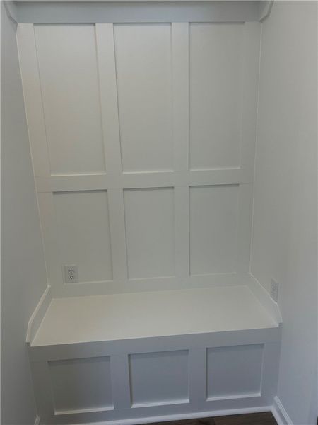 This built-in seating area features classic wainsc