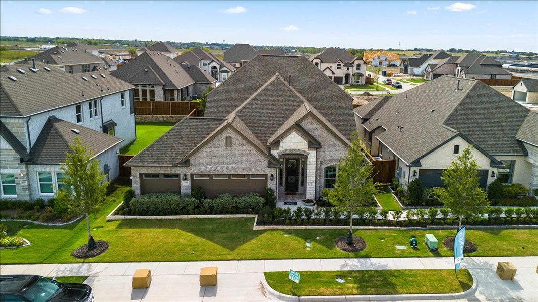 Front exterior of a new home in Las Lomas, Forney, TX, highlighting curb appeal (Image 16). Front exterior of a new home in Las Lomas, Forney, TX, highlighting curb appeal (Image 16).