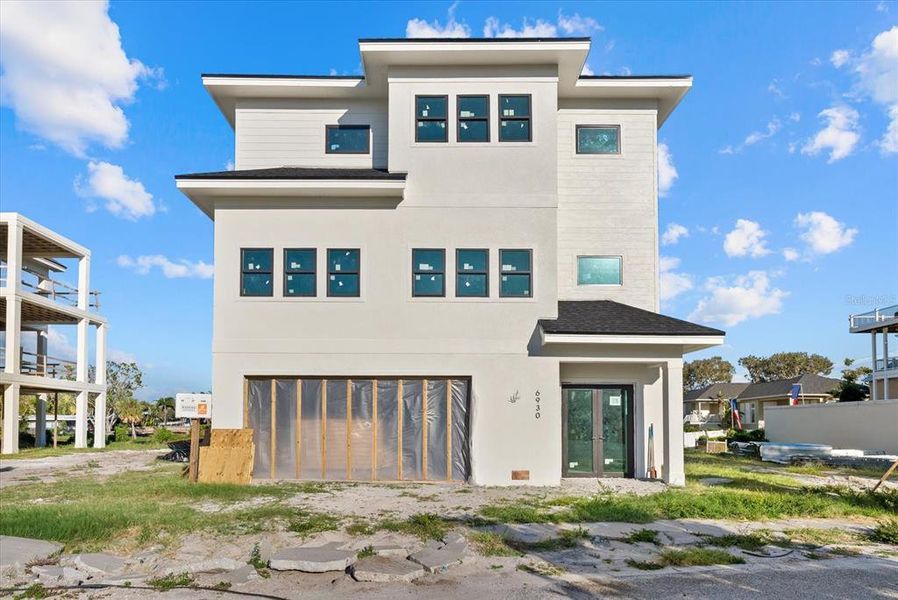 Front exterior of a new home in , Sarasota, FL, highlighting curb appeal (Image 13).