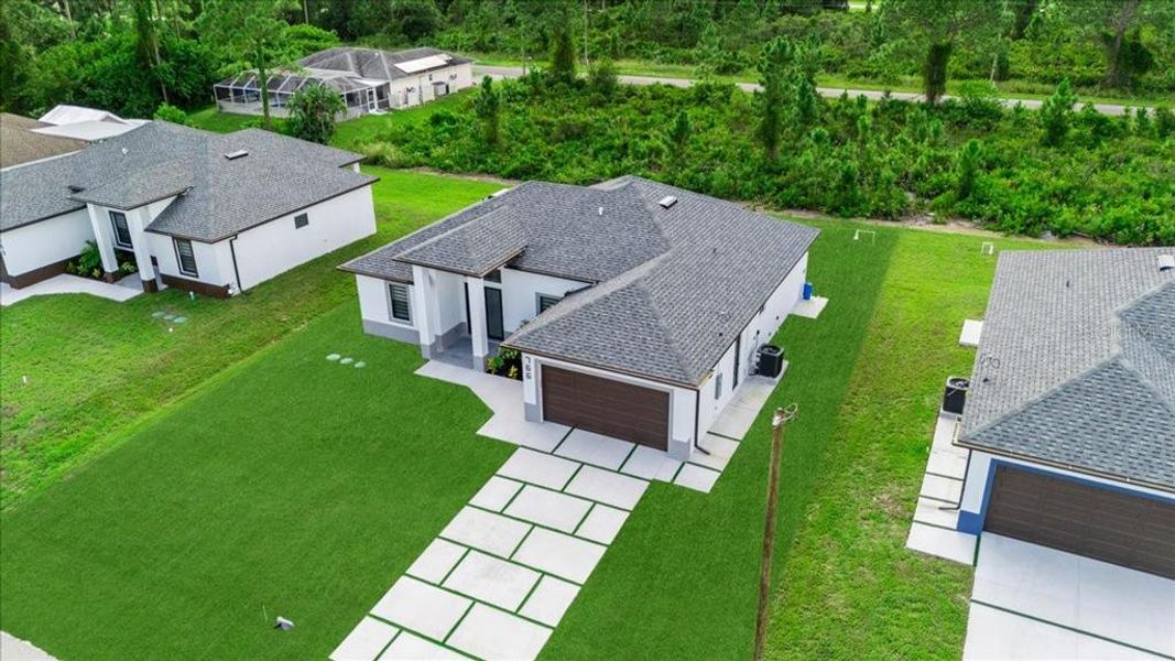 Front exterior of a new home in , Lehigh Acres, FL, highlighting curb appeal (Image 23).