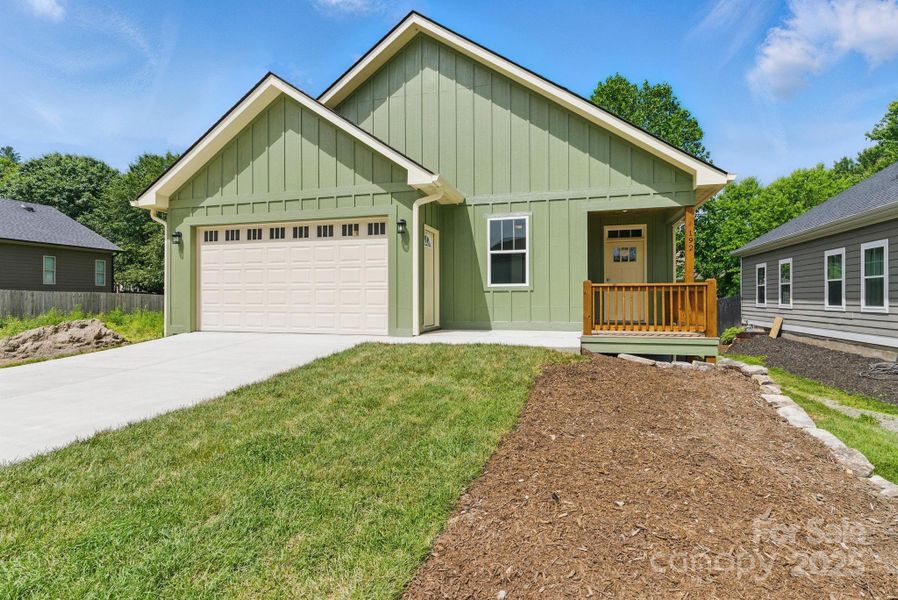 Front exterior of a new home in , Etowah, NC, highlighting curb appeal (Image 1). Front exterior of a new home in , Etowah, NC, highlighting curb appeal (Image 1).