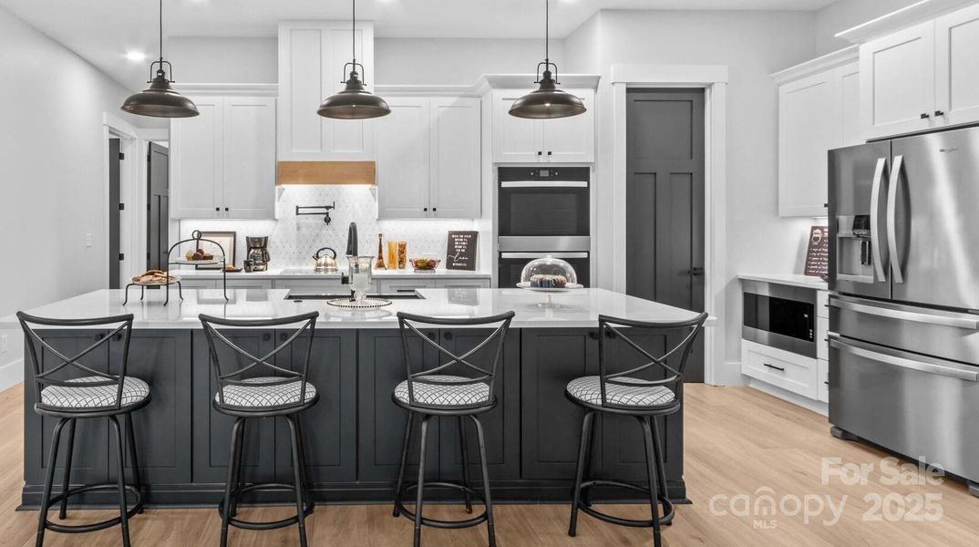 Appliances include the Refrigerator, 2 ovens, cooktop, dishwasher, microwave & pot filler.