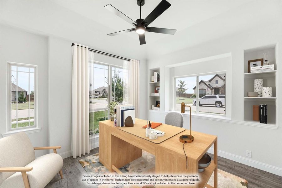 Home office with wood desk, built-in shelves, ceiling fan, and large windows with neighborhood views