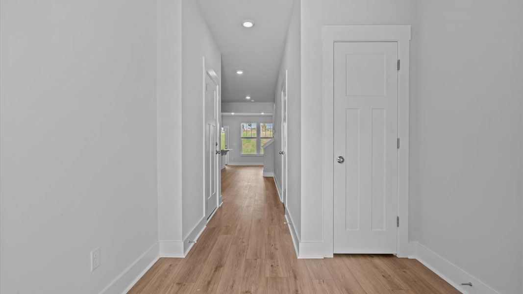 Superior design begins at the front door with a hardwood floor foyer and elegant sightlines Superior design begins at the front door with a hardwood floor foyer and elegant sightlines
