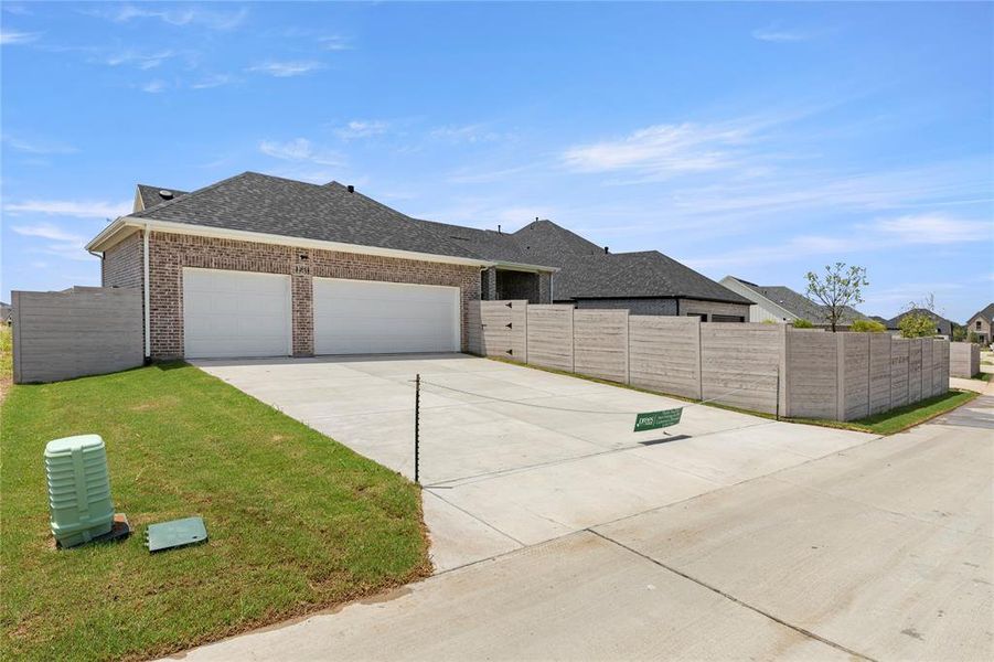 Front exterior of a new home in Painted Tree Showcase, McKinney, TX, highlighting curb appeal (Image 18).