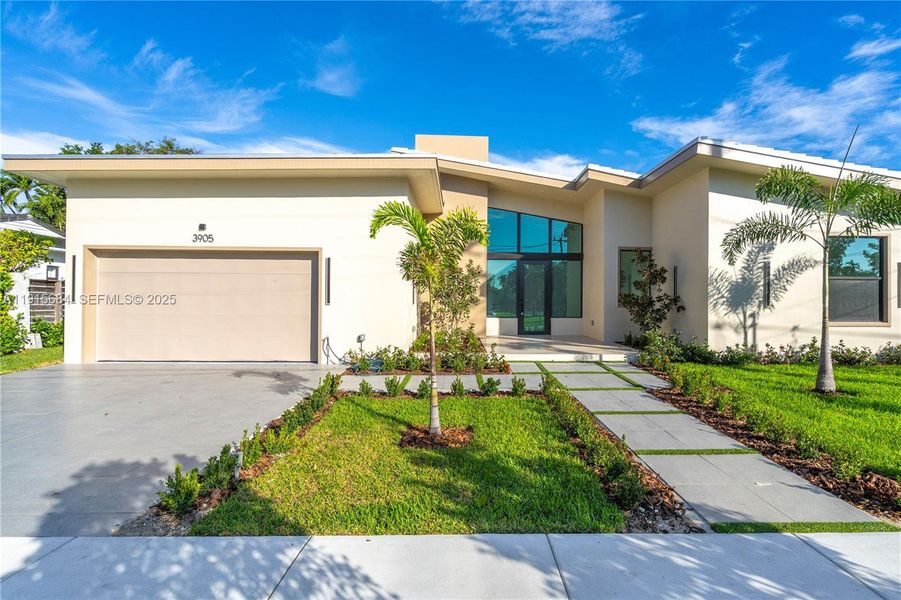 Front exterior of a new home in , Coral Gables, FL, highlighting curb appeal (Image 2). Front exterior of a new home in , Coral Gables, FL, highlighting curb appeal (Image 2).