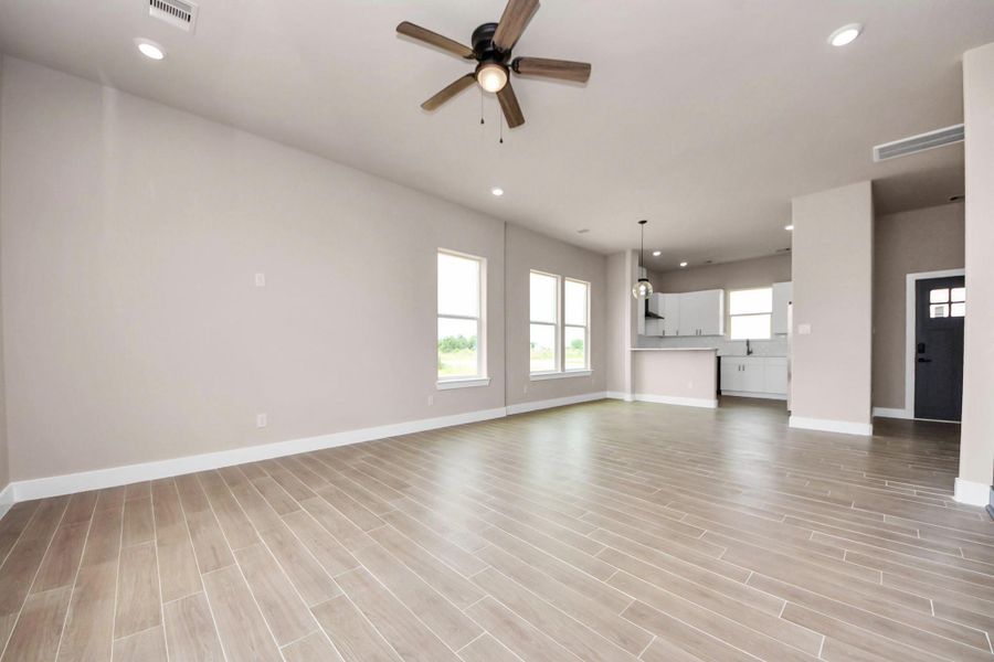 Open living room to dining and kitchen. Open living room to dining and kitchen.