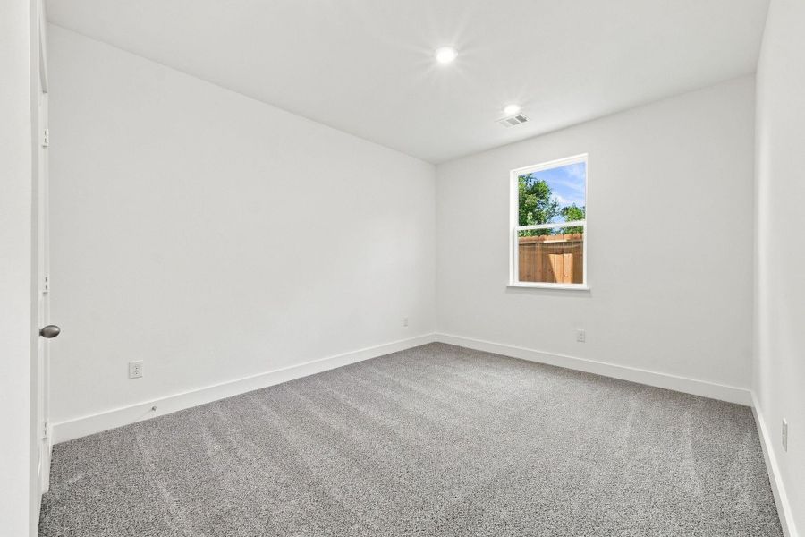 Secondary bedroom with natural light, neutral finishes, and flexible space for bedroom furniture or additional uses. Secondary bedroom with natural light, neutral finishes, and flexible space for bedroom furniture or additional uses.