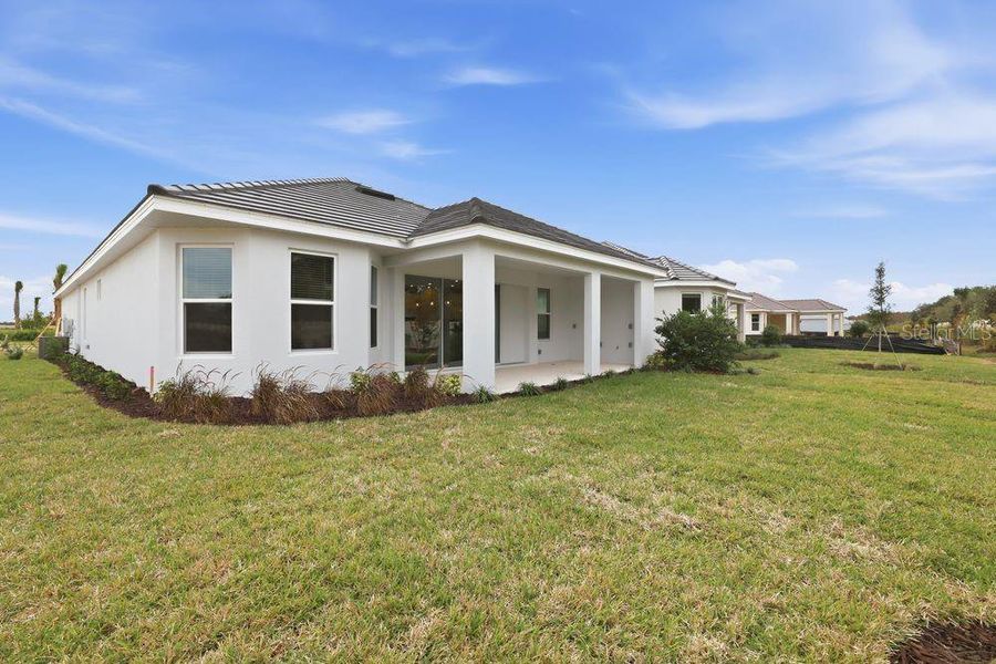 Exterior details and patio area of a home in Esplanade at Wiregrass Ranch, Wesley Chapel (Image 28). Exterior details and patio area of a home in Esplanade at Wiregrass Ranch, Wesley Chapel (Image 28).