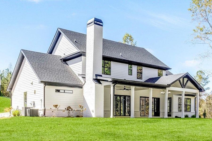 Front exterior of a new home in , Newnan, GA, highlighting curb appeal (Image 1).