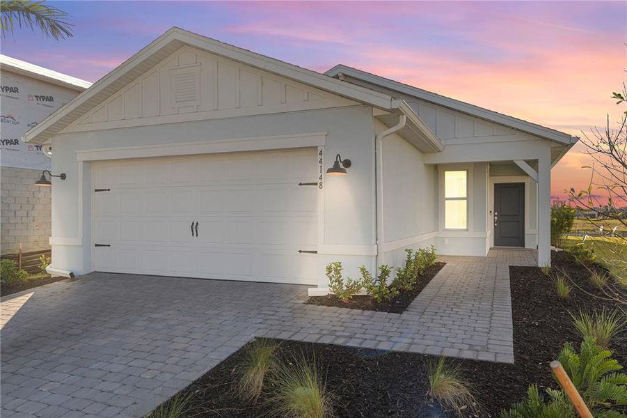 Front exterior of a new home in , Punta Gorda, FL, highlighting curb appeal (Image 23).