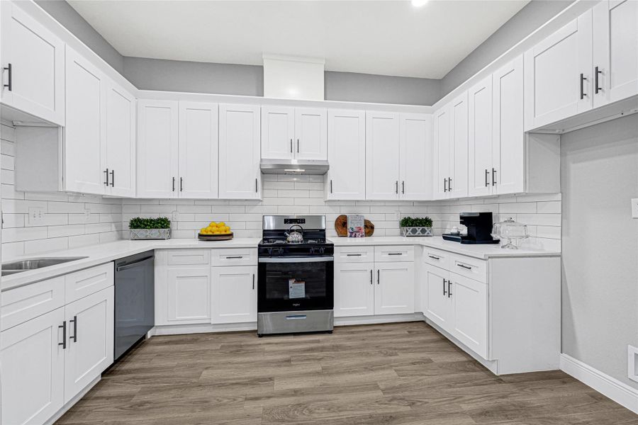 Custom cabinetry throughout with marvelous countertops