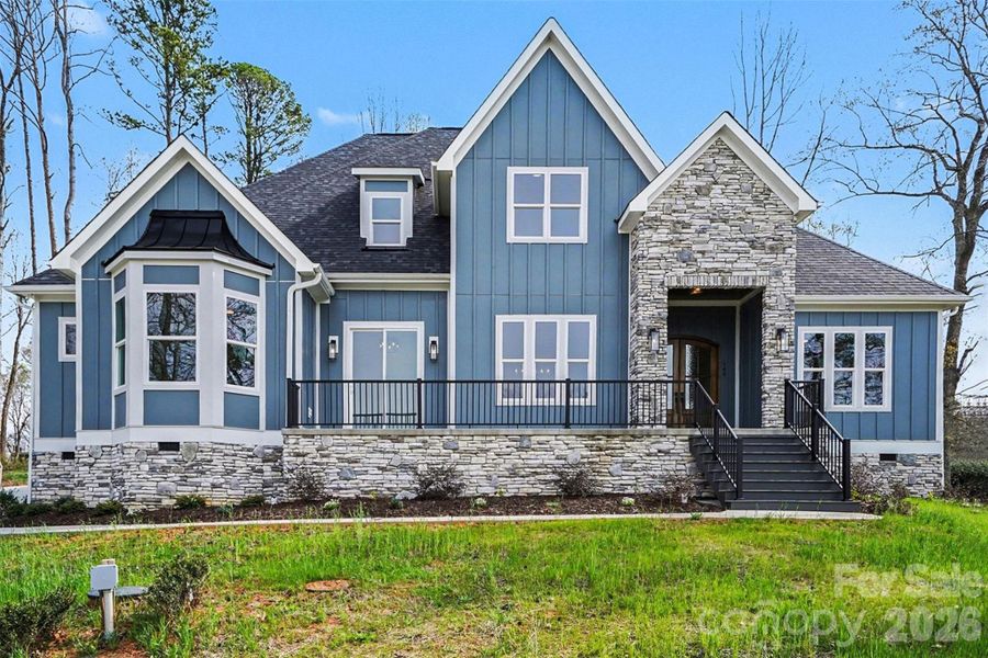 Front exterior of a new home in , Troutman, NC, highlighting curb appeal (Image 27).