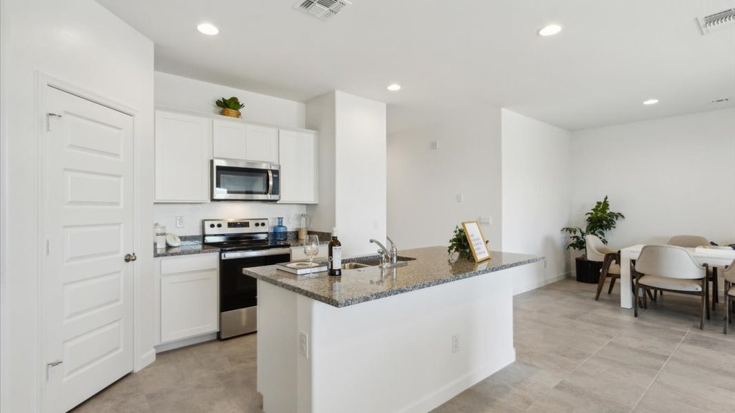 Representative furnished interior of a home built from the Justin by D.R. Horton in Sorrento, Maricopa (Image 9).