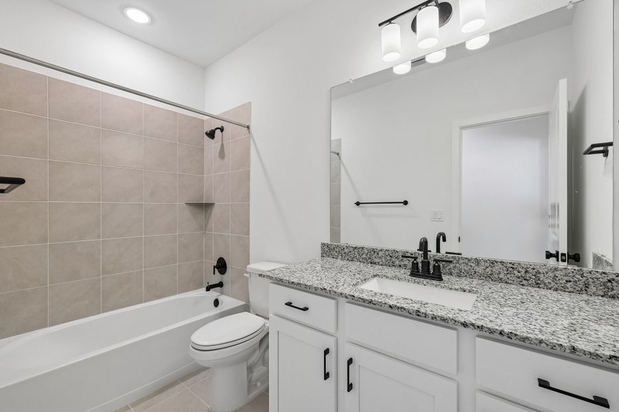 Representative furnished interior of a home built from the 4013 by Risewell Homes in Parkton Square, Kyle (Image 10).