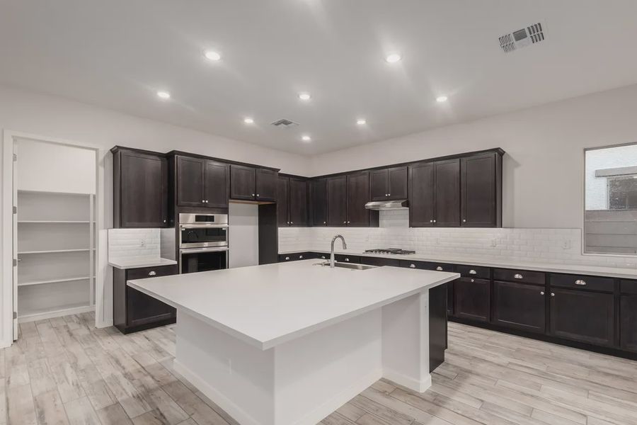 Furnished interior view inside a new home in Valencia at Granite Vista, Waddell (Image 6).