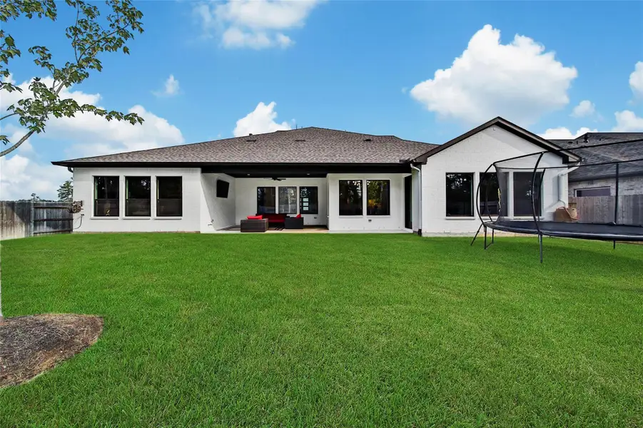 Exterior details and patio area of a home in ARTAVIA, Conroe (Image 23).