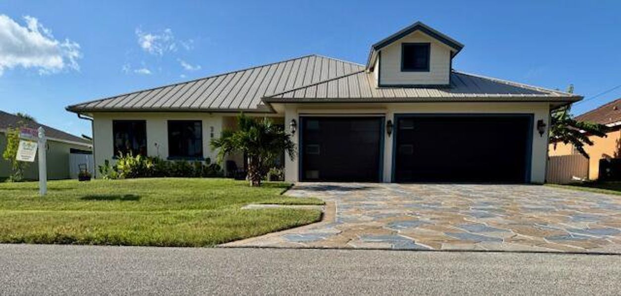 Front exterior of a new home in , Port St. Lucie, FL, highlighting curb appeal (Image 18).