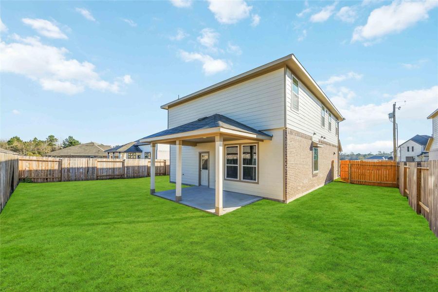 Exterior details and patio area of a home in Splendora Fields, Splendora (Image 3).