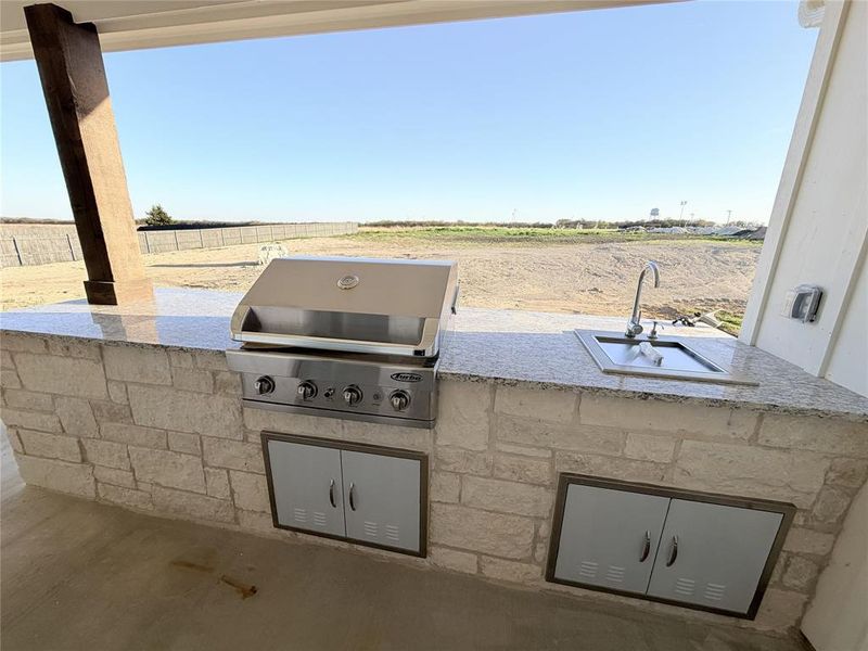 View of patio / terrace with an outdoor kitchen and a view of countryside View of patio / terrace with an outdoor kitchen and a view of countryside