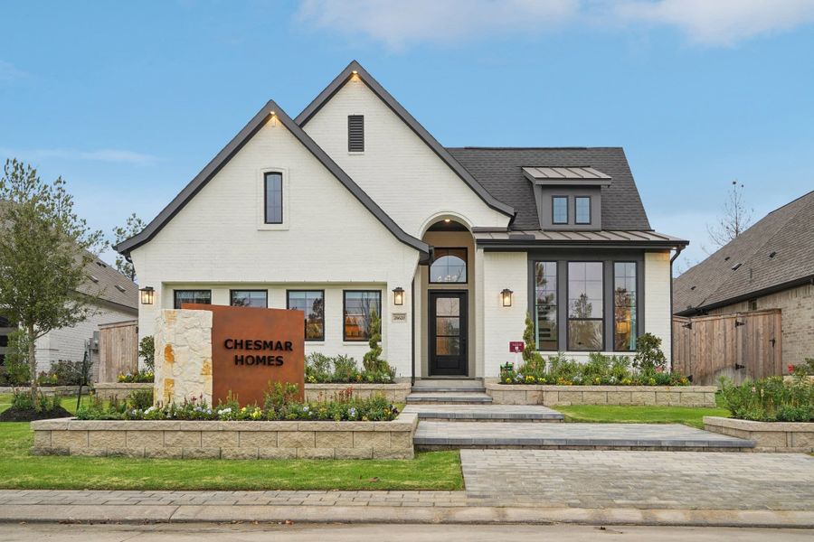 Representative exterior photo of a completed home built from the Hampton by Chesmar Homes in Berry Creek Highlands, Georgetown, TX (Image 14).