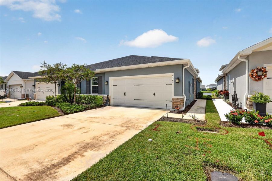 Front exterior of a new home in , Port St. Lucie, FL, highlighting curb appeal (Image 22). Front exterior of a new home in , Port St. Lucie, FL, highlighting curb appeal (Image 22).