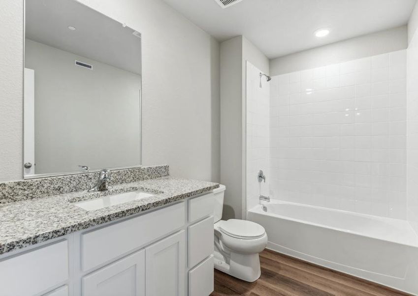 The secondary bathroom has a tub shower combo.