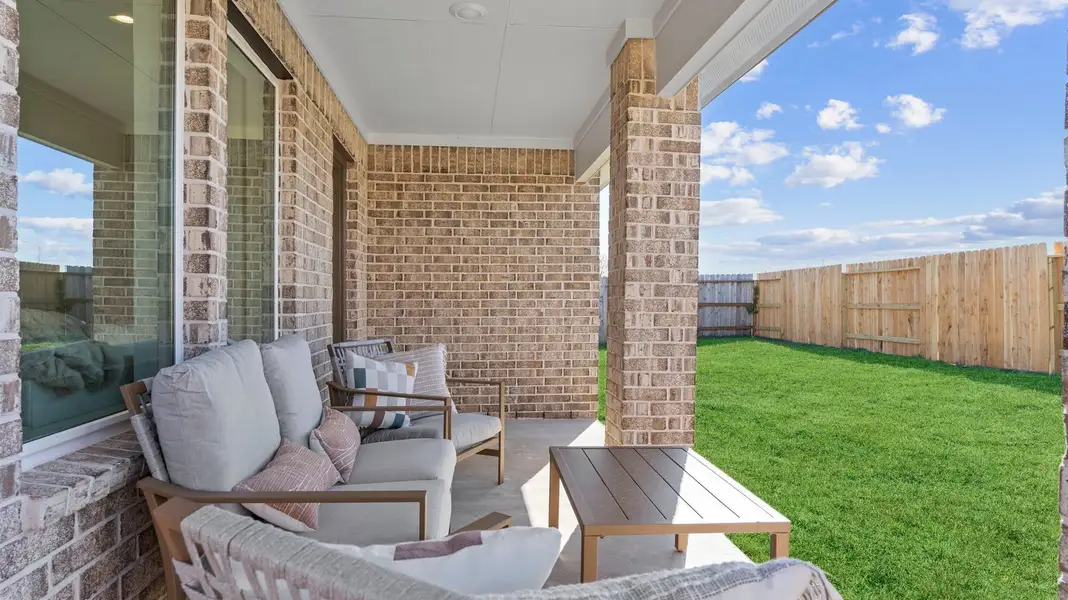 Exterior details and patio area of a home in Caldwell Crossing, Iowa Colony (Image 2). Exterior details and patio area of a home in Caldwell Crossing, Iowa Colony (Image 2).