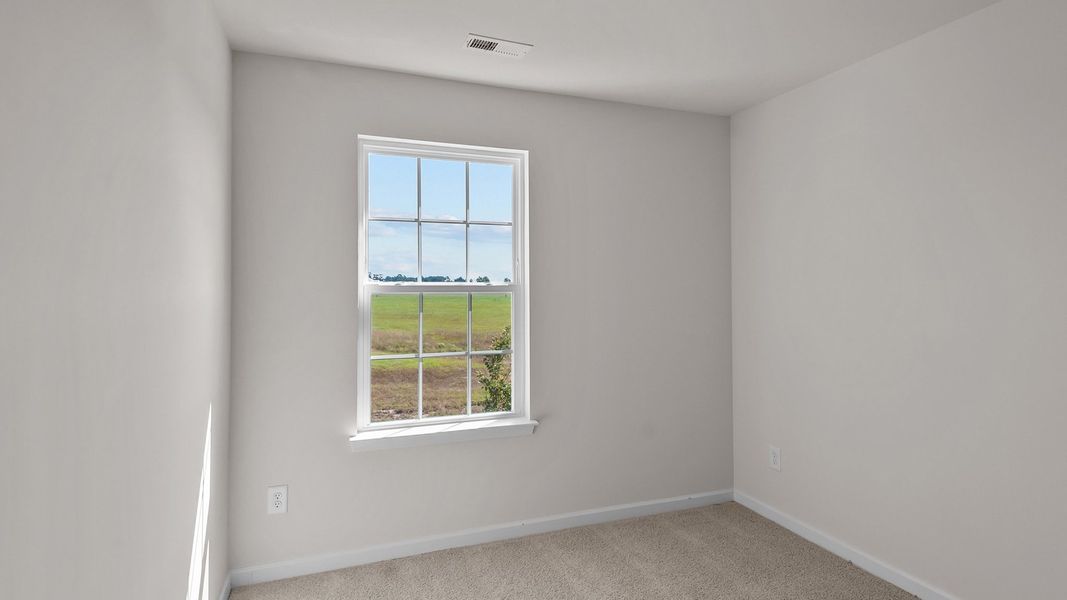 Spacious, unfurnished interior of a new home in Edinborough Townes, Gibsonville (Image 15).