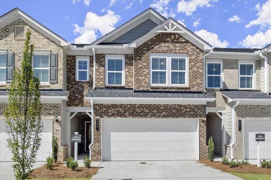 Front exterior of a new home in , Dacula, GA, highlighting curb appeal (Image 27).