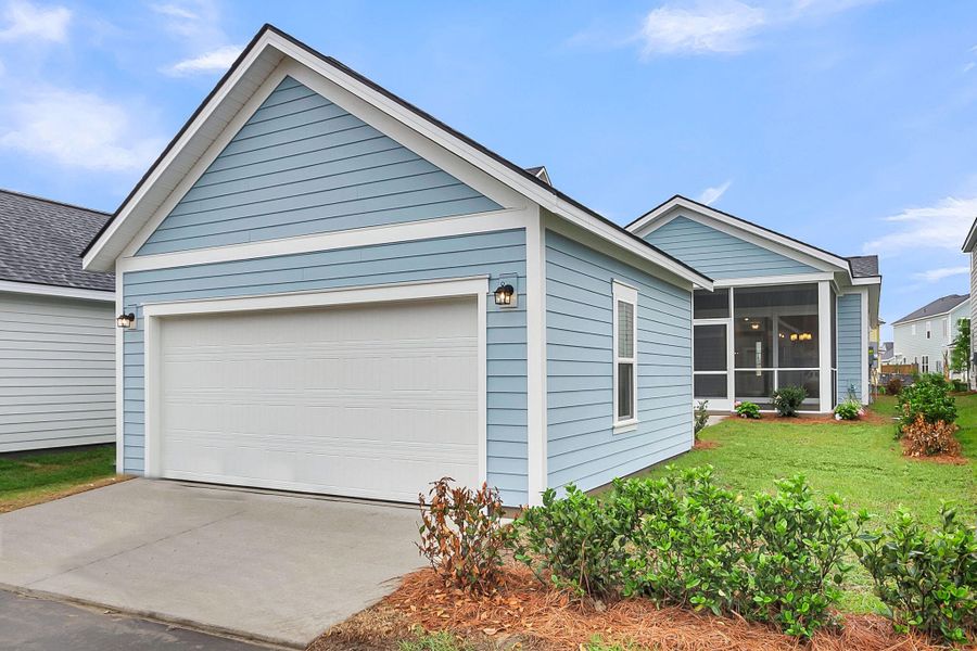 Front exterior of a new home in Midtown at Nexton, Summerville, SC, highlighting curb appeal (Image 1). Front exterior of a new home in Midtown at Nexton, Summerville, SC, highlighting curb appeal (Image 1).