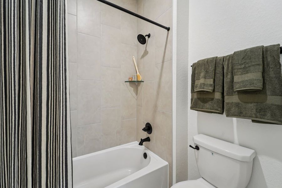 Furnished interior view inside a new home in Bridgeland, Cypress (Image 16).